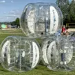 Drei aufgeblasene Bubble Soccer Fußbälle oder Bumper Bälle am Seaside Beach in Essen für den Kunden Moselbad aus Koblenz.
