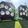 Zwei hellgrüne, aufgeblasene Fußball Darts vom VFL Wolfsburg mit Spielflächen angelegt als Torwand mit 7 Löchern